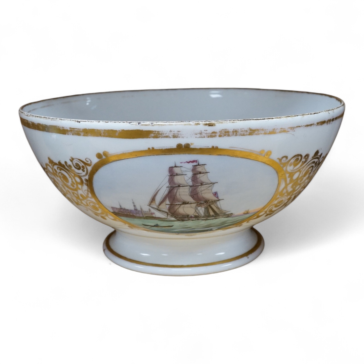 A French porcelain bowl, painted with a British ship, dated 1855, 28cm diameter. Condition - poor